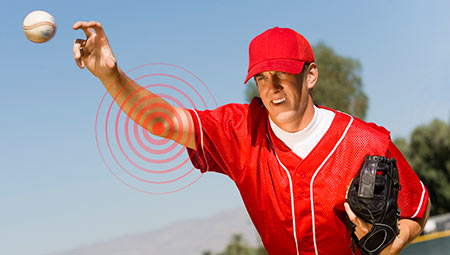 Pitcher throwing baseball.